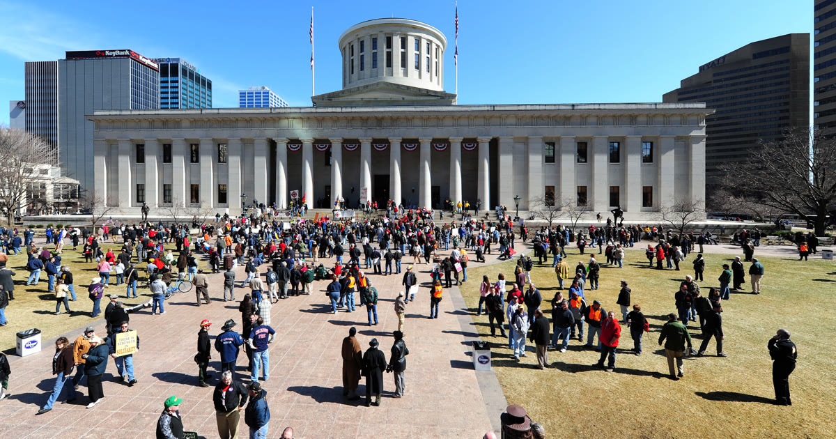 Protesters gather on the Ohio Statehouse lawn in Columbus for the No Kings rally