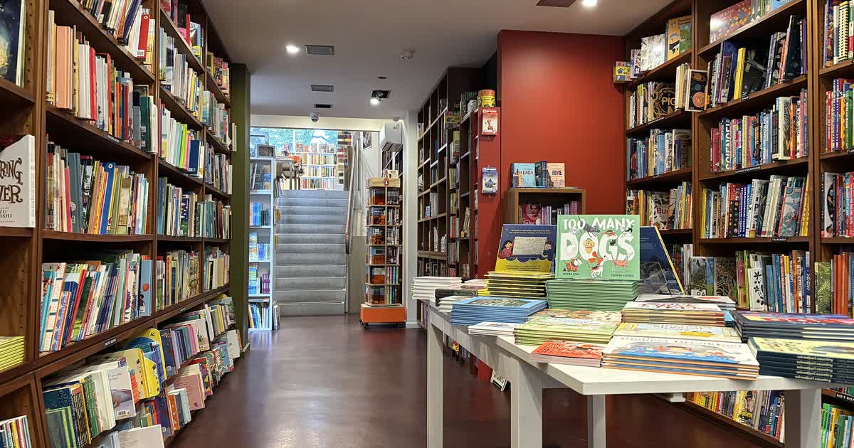 Children books on shelves and tables in a bookstore