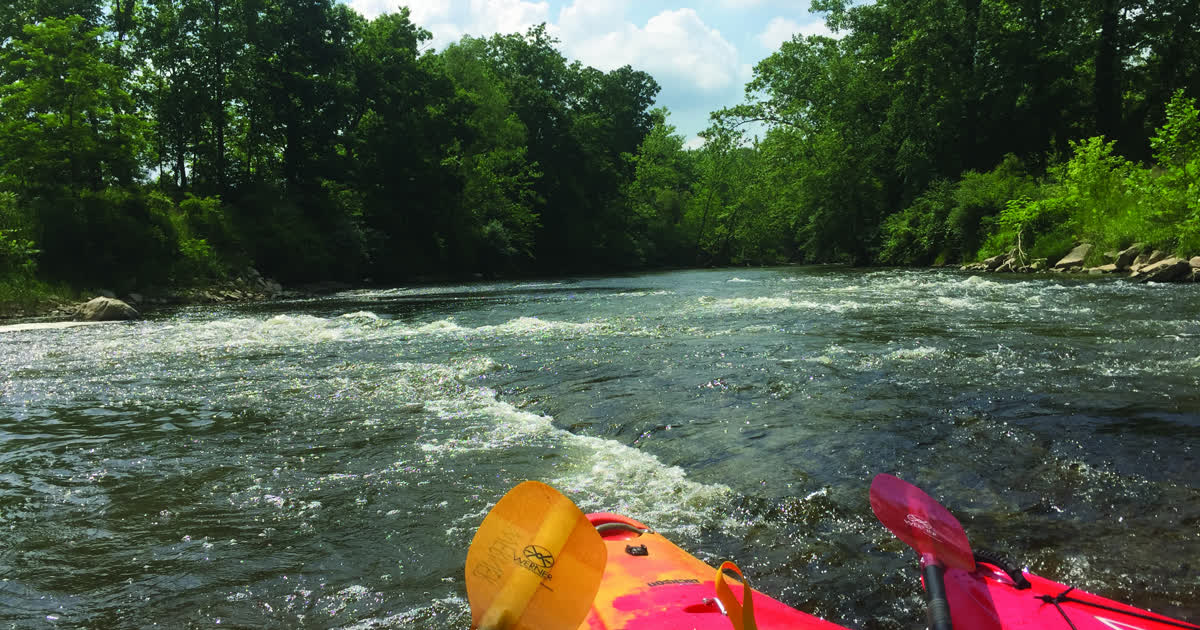 Kayakers paddling rapids on the Cuyahoga River in Ohio