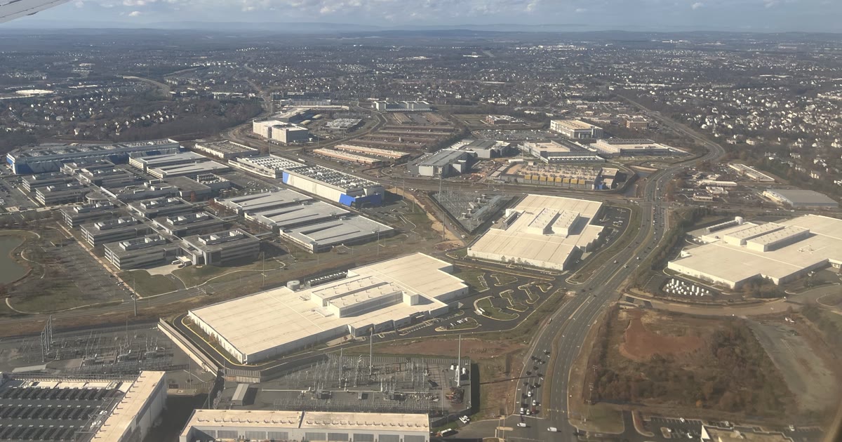 Aerial view of data center buildings and an electrical substation