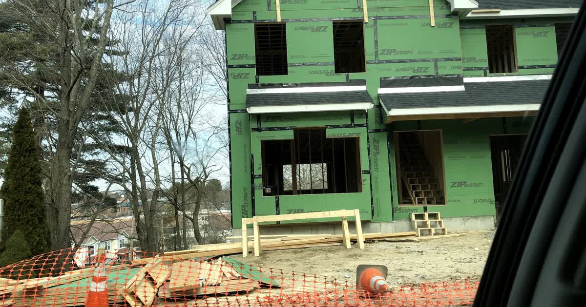 A new home under construction with framing and sheathing