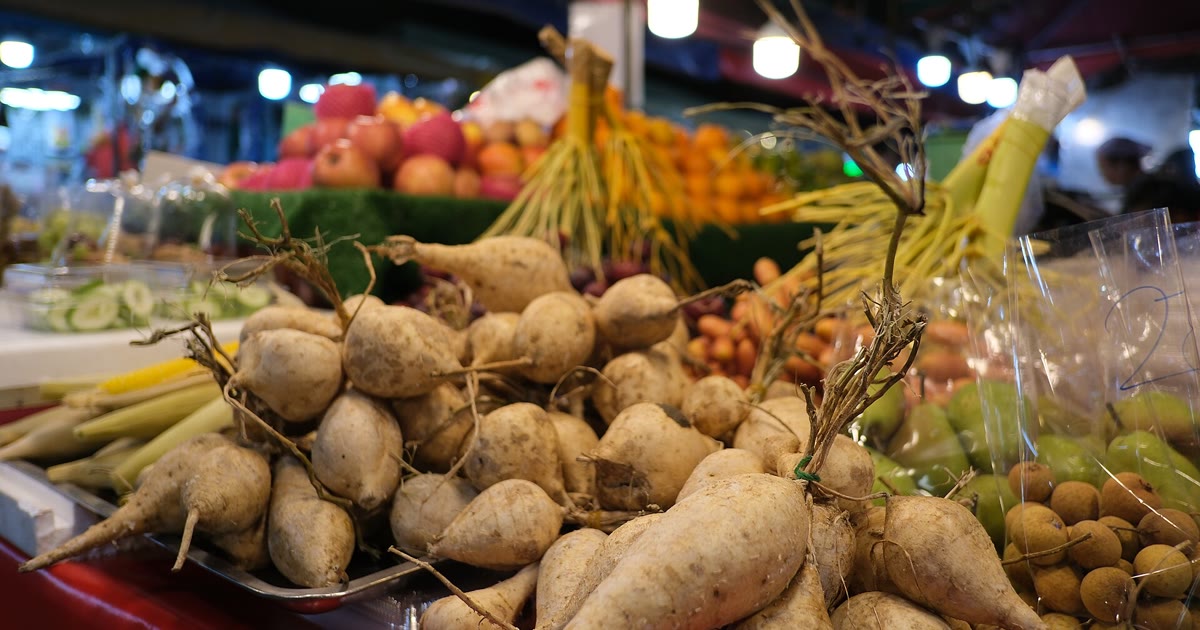 Fresh produce at a farmers market stall