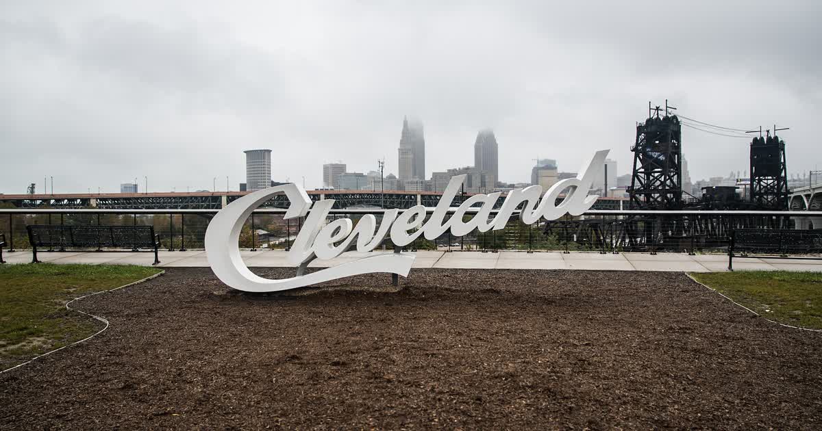 The Cleveland script sign and downtown Cleveland skyline