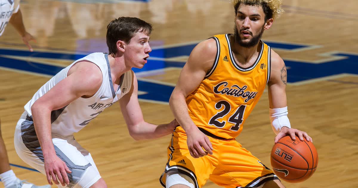 Air Force Academy player defending during a Falcons mens basketball game