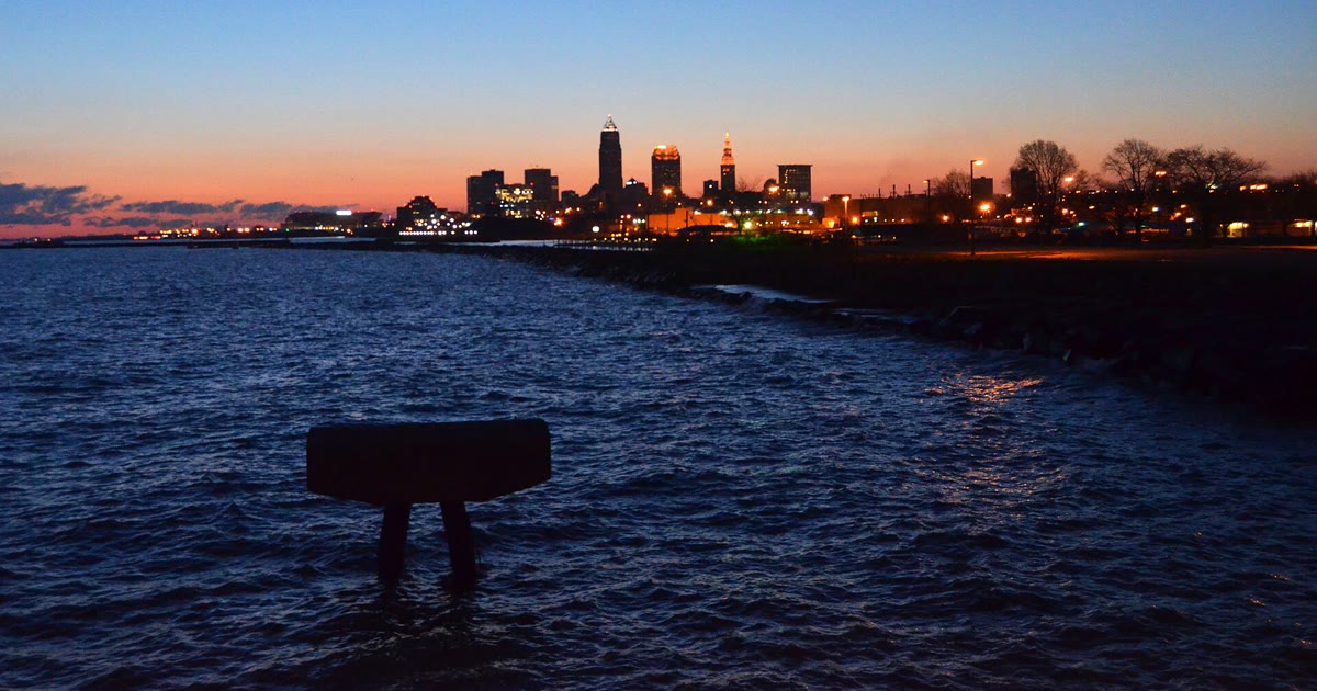 Cleveland skyline at sunrise seen from Edgewater Park across Lake Erie