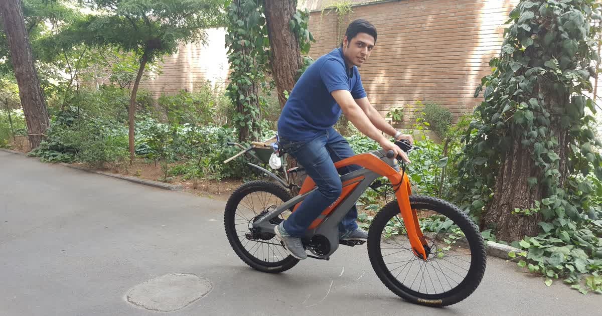 Man riding an electric bicycle on a shared-use path