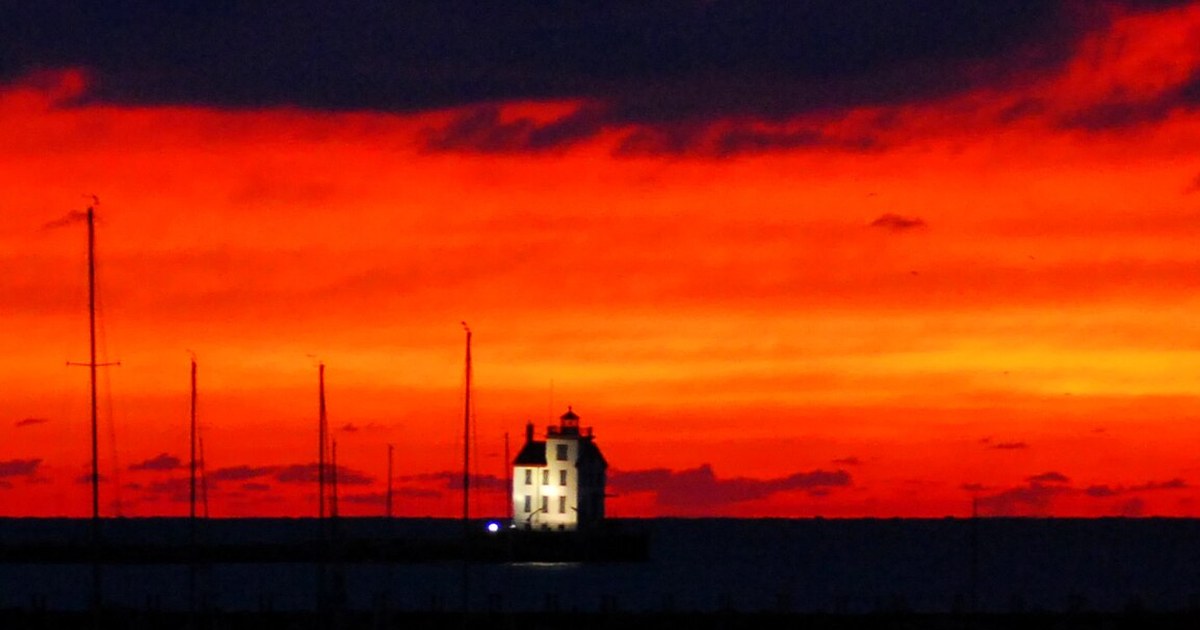 Sunset over Lorain harbor on Lake Erie under a clear evening sky in Ohio