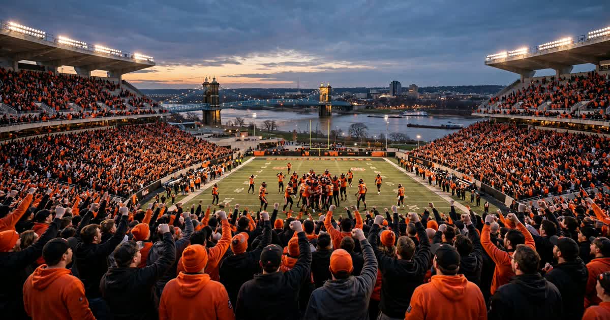 Cincinnati football stadium crowd in orange and black at dusk