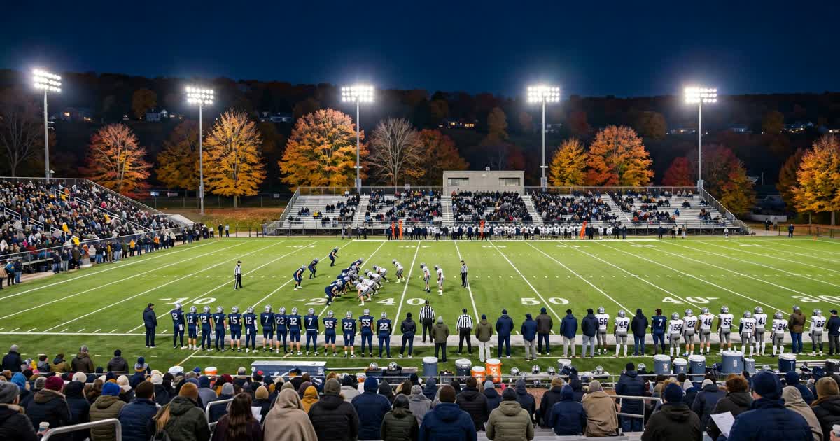 Ohio high school football teams line up under stadium lights on an autumn night