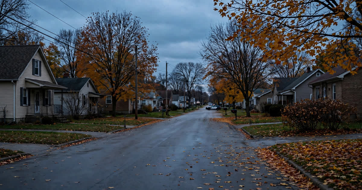 A quiet residential street in an Ohio city at dusk in autumn