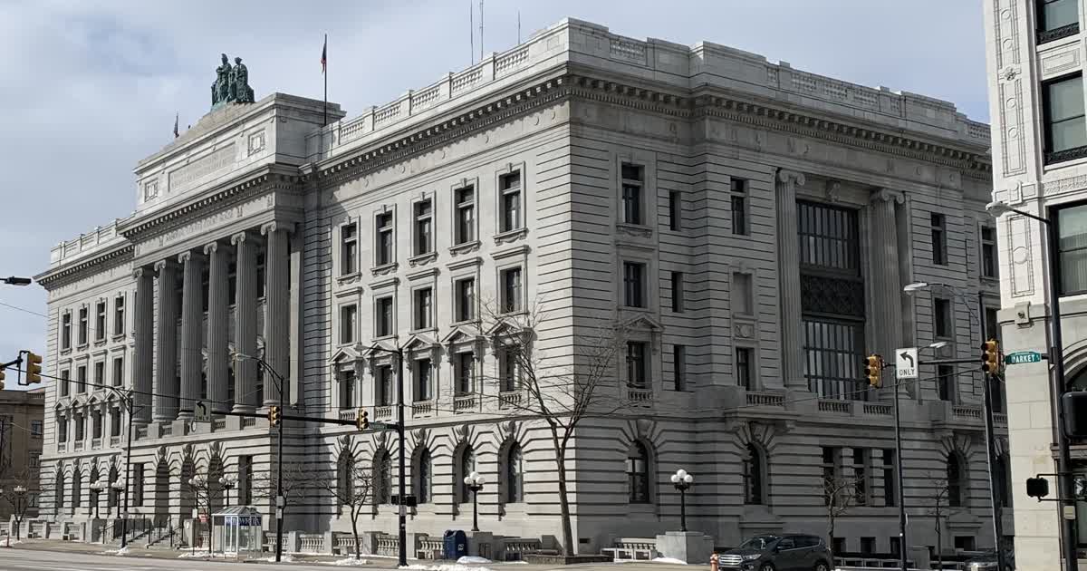 The Mahoning County Courthouse, a large stone building with columns in downtown Youngstown
