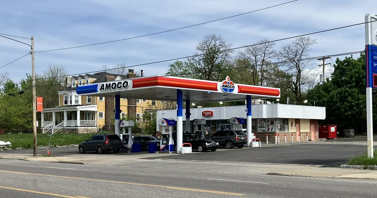 An Amoco gas station with cars at the pumps in East Cleveland, Ohio