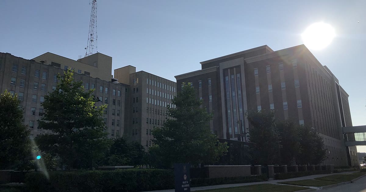 The Marathon Petroleum corporate complex in Findlay, Ohio, glass office buildings behind a landscaped pond
