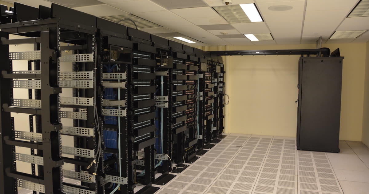 Rows of server racks inside a data center