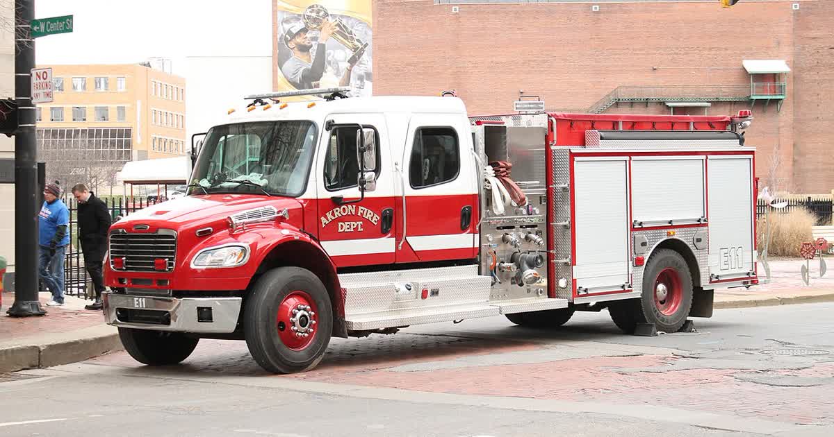 An Akron Fire Department engine on a city street