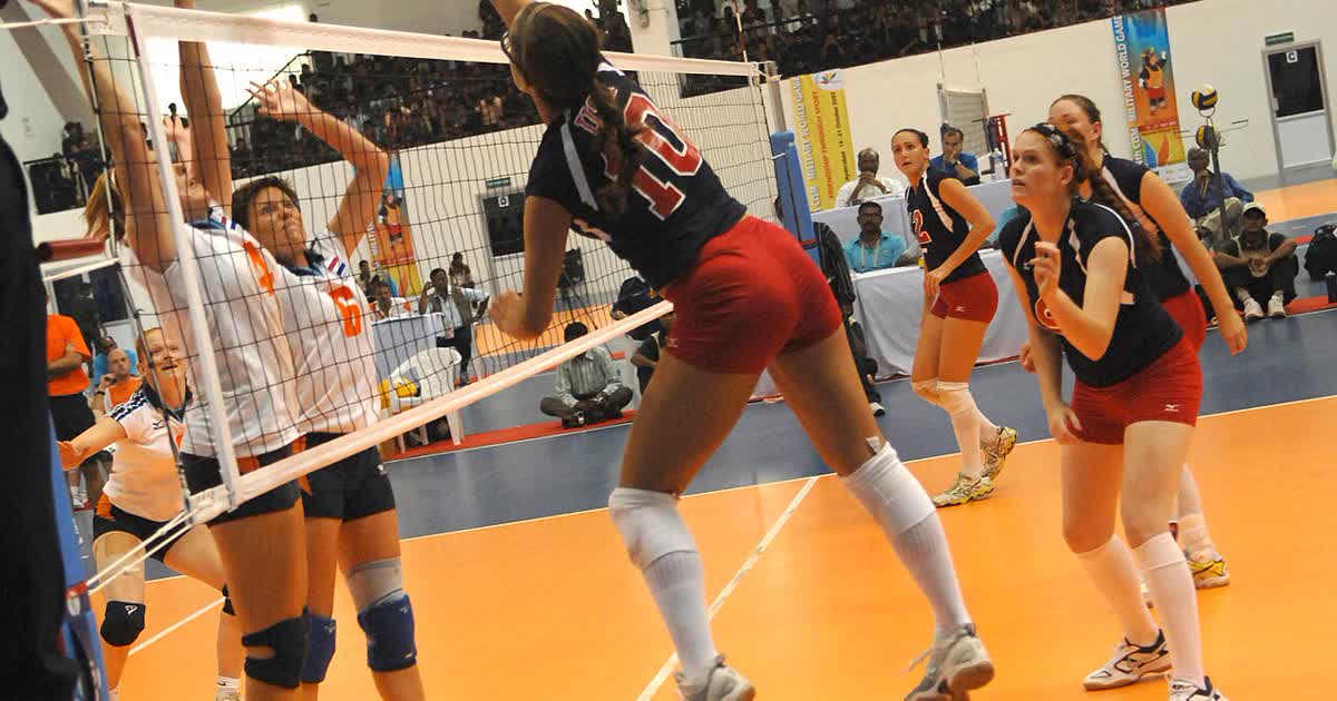 Womens volleyball action at the net