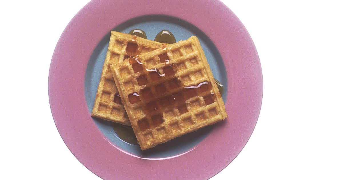 Belgian waffles with syrup on a plate