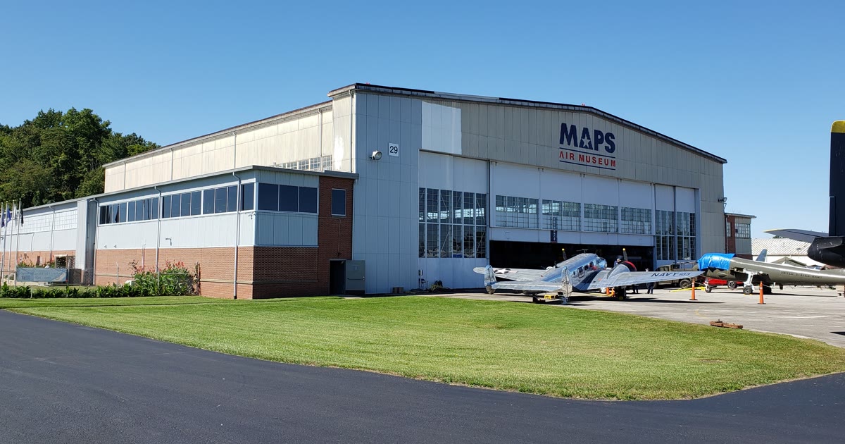 The MAPS Air Museum hangar in Green, Ohio, with vintage aircraft parked outside