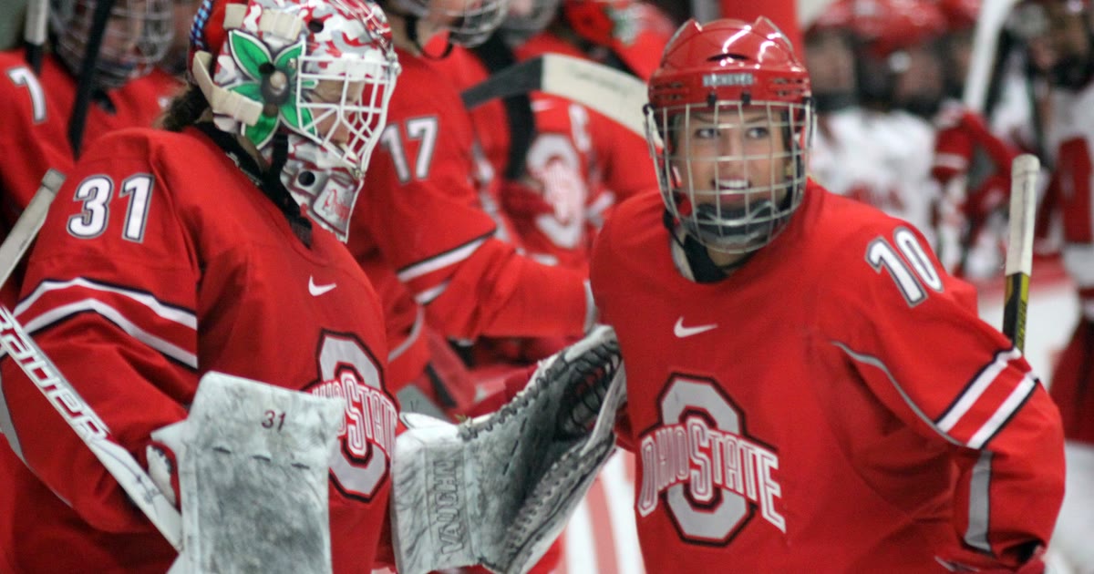 Ohio State women's hockey players in scarlet jerseys on the ice