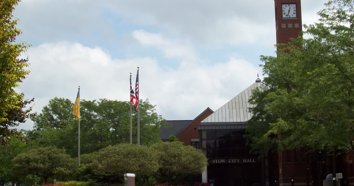 Stow City Hall in Stow, Ohio, with its clock tower and flags