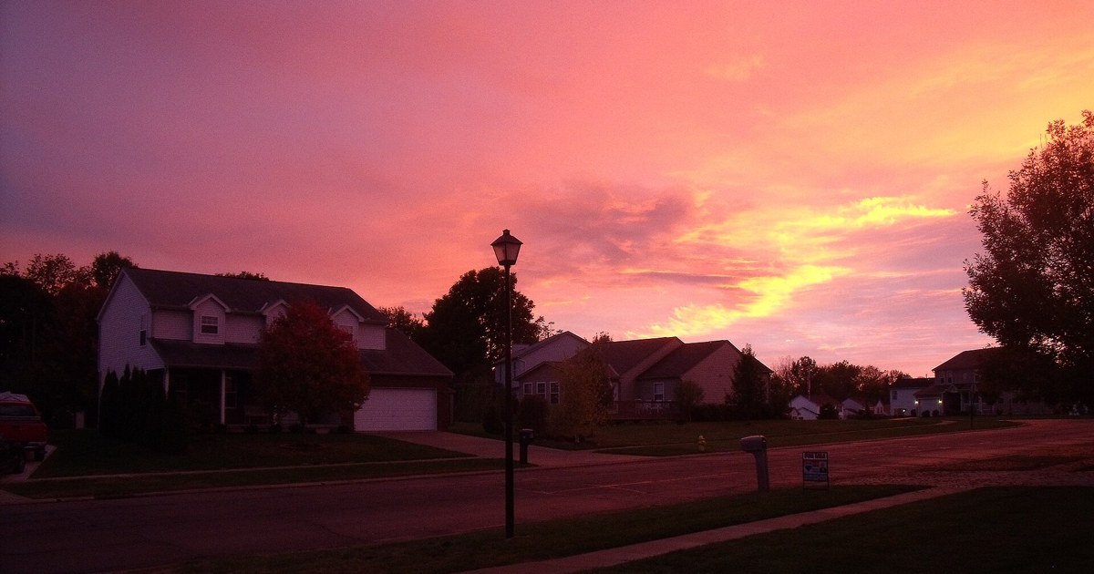 Sunset over a residential neighborhood in Heath, Ohio, with a pink and orange evening sky