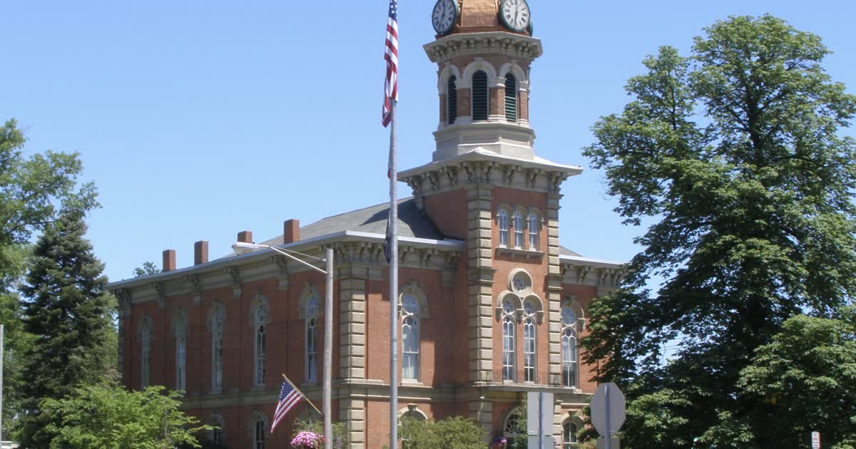 The Geauga County Courthouse, a red-brick building with a copper clock tower, in Chardon, Ohio