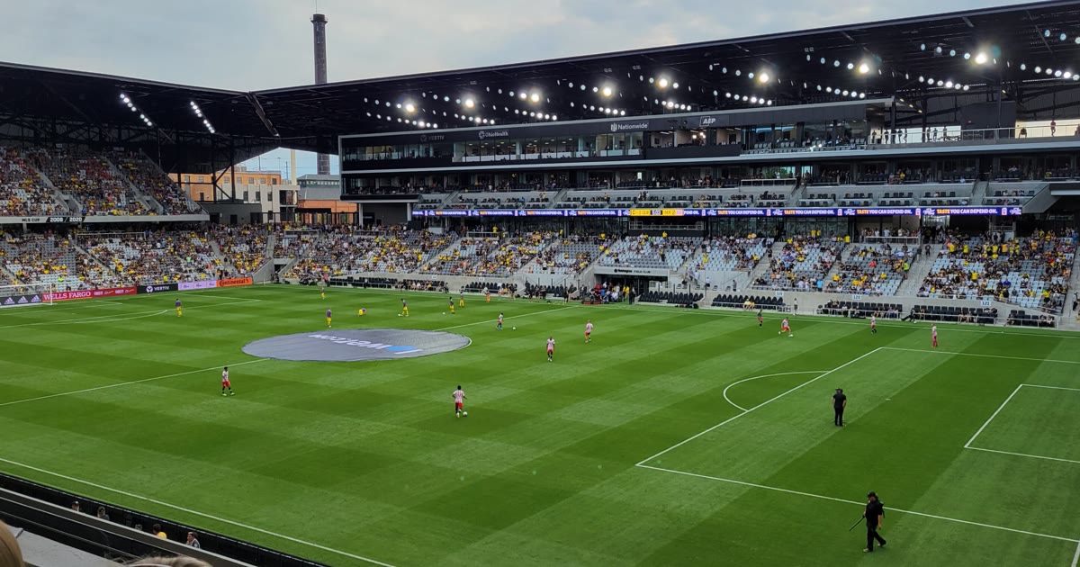 The Columbus soccer stadium in the Arena District during a match, with fans filling the stands