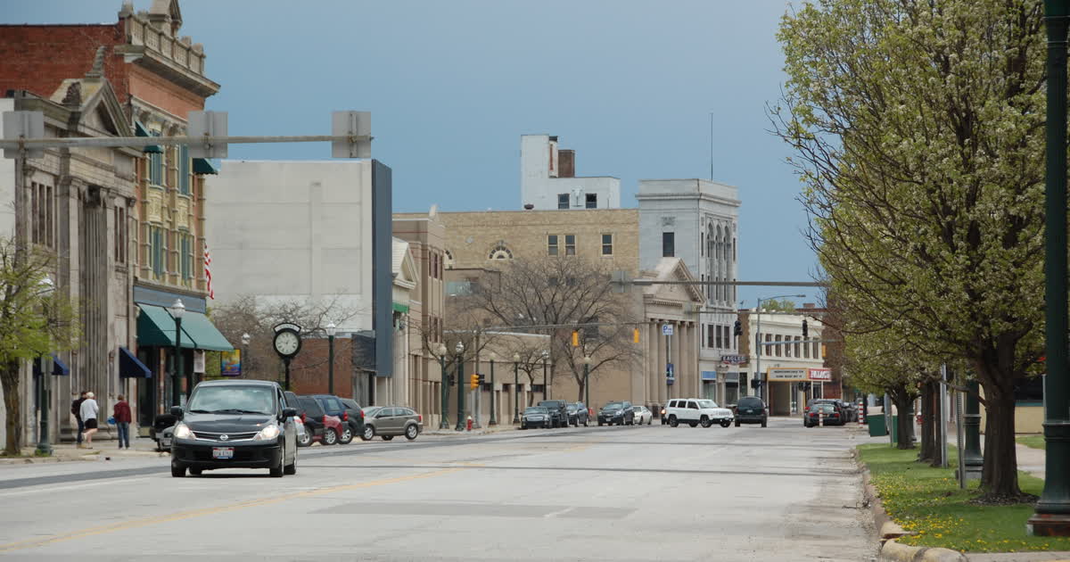Downtown Lorain, Ohio, looking along a main street with storefronts and a street clock