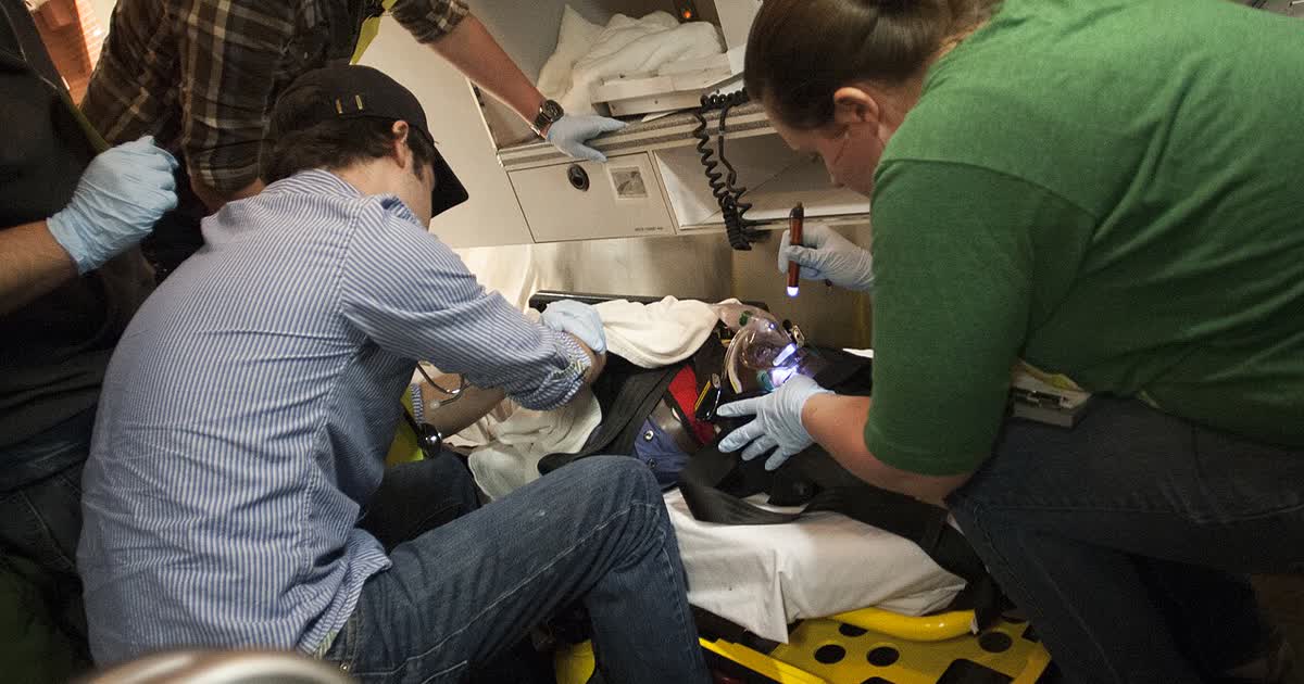 Students training in an emergency medical simulation